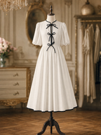 Vintage Contrast Trim Puff Sleeve Front Bow A‑Line Midi Dress