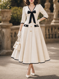 Vintage Black Trim Bow Front V‑Neck A‑Line Midi Dress